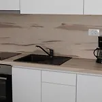 Mili *